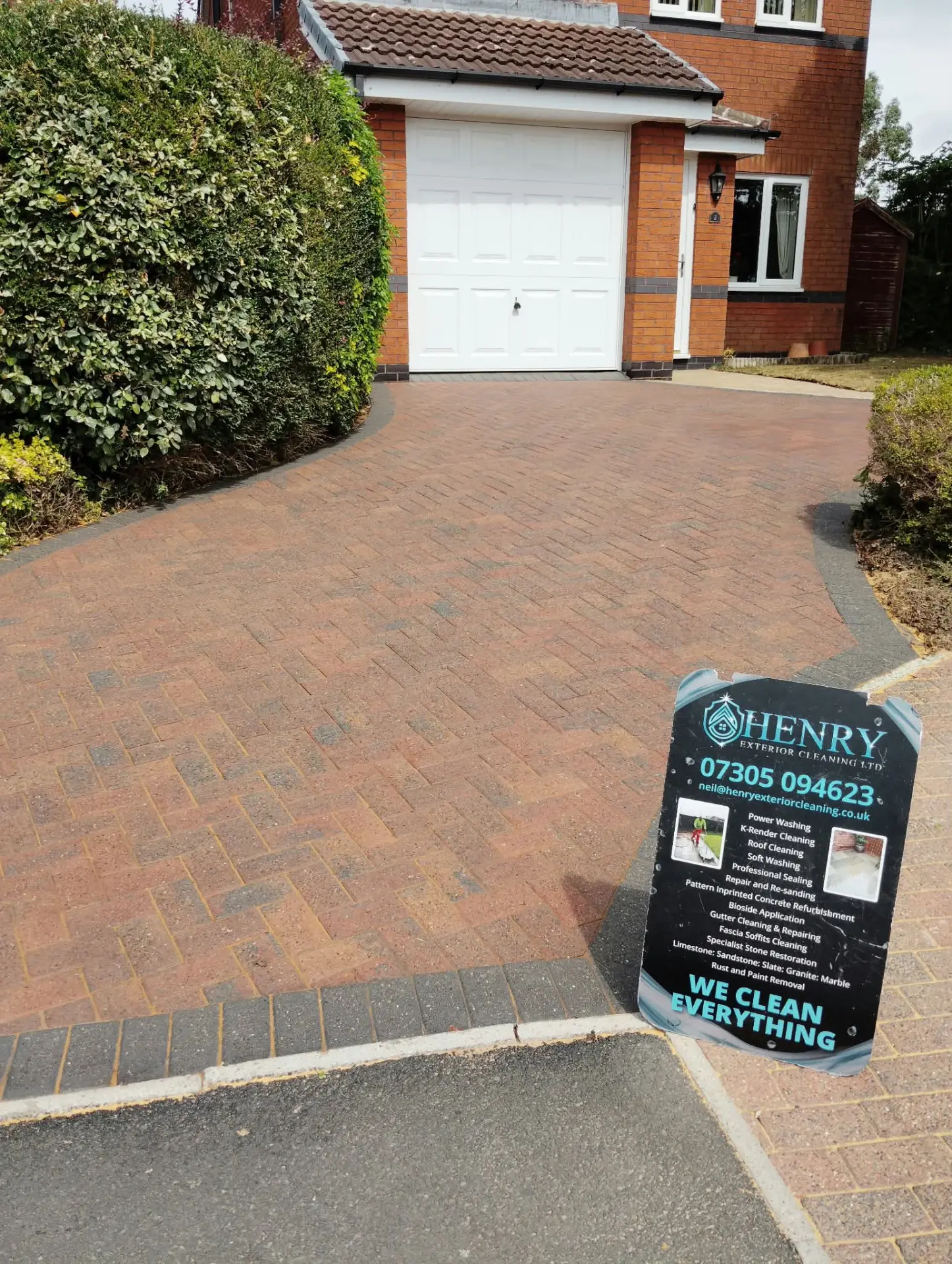 Cleaned and re-sanded block paving driveway with the Henry Exterior Cleaning board in place