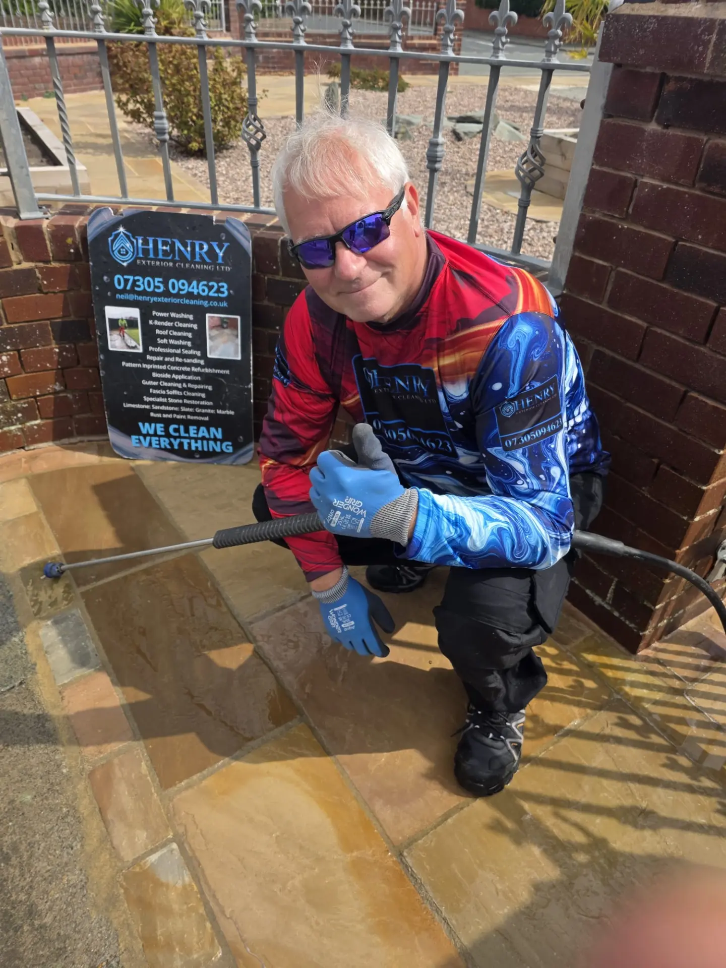 Henry Exterior Cleaning technician cleaning a sandstone patio in Lytham St Anne's