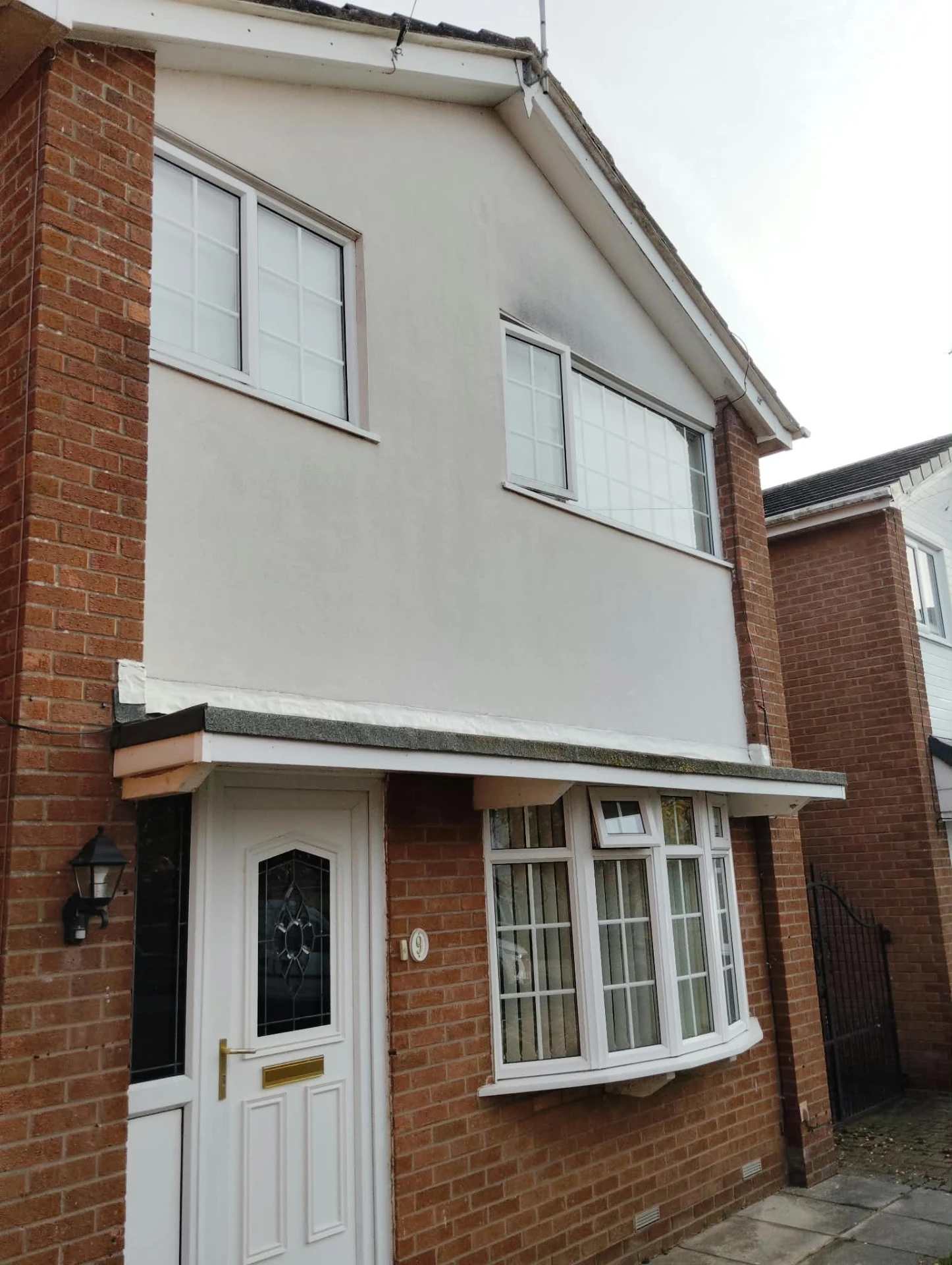 Rendered front elevation cleaned back to a bright even finish