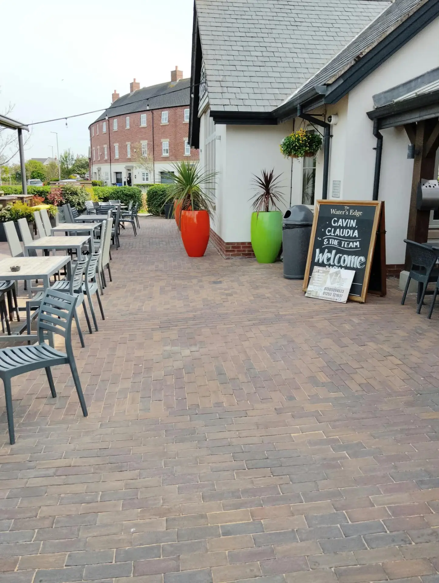 Clay paved frontage and clean K-Rend elevation at The Water's Edge