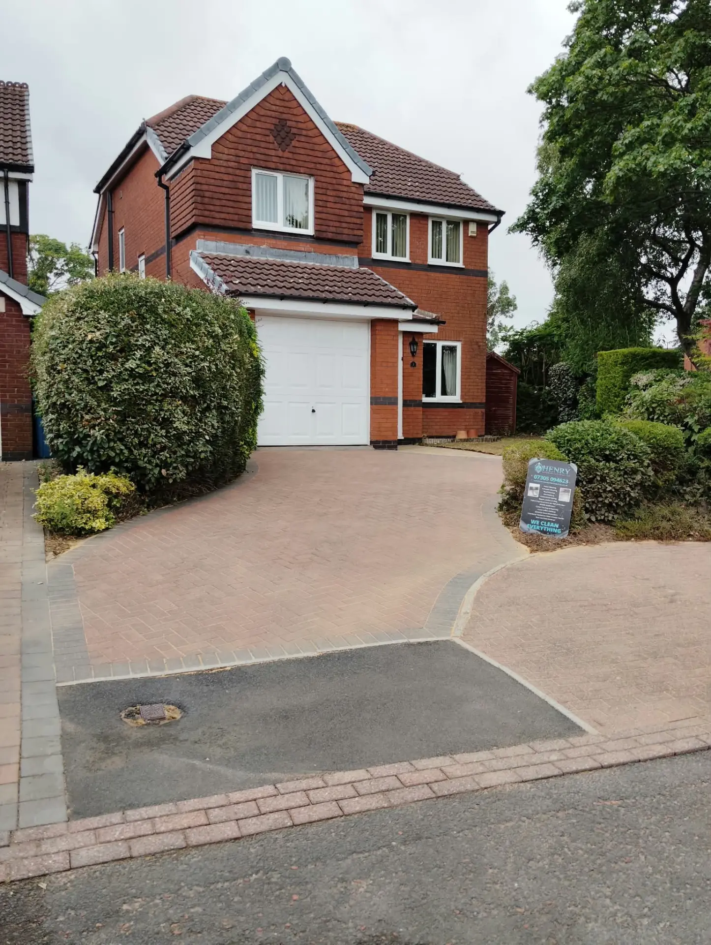 Completed block paving driveway and footpath viewed from the road after restoration