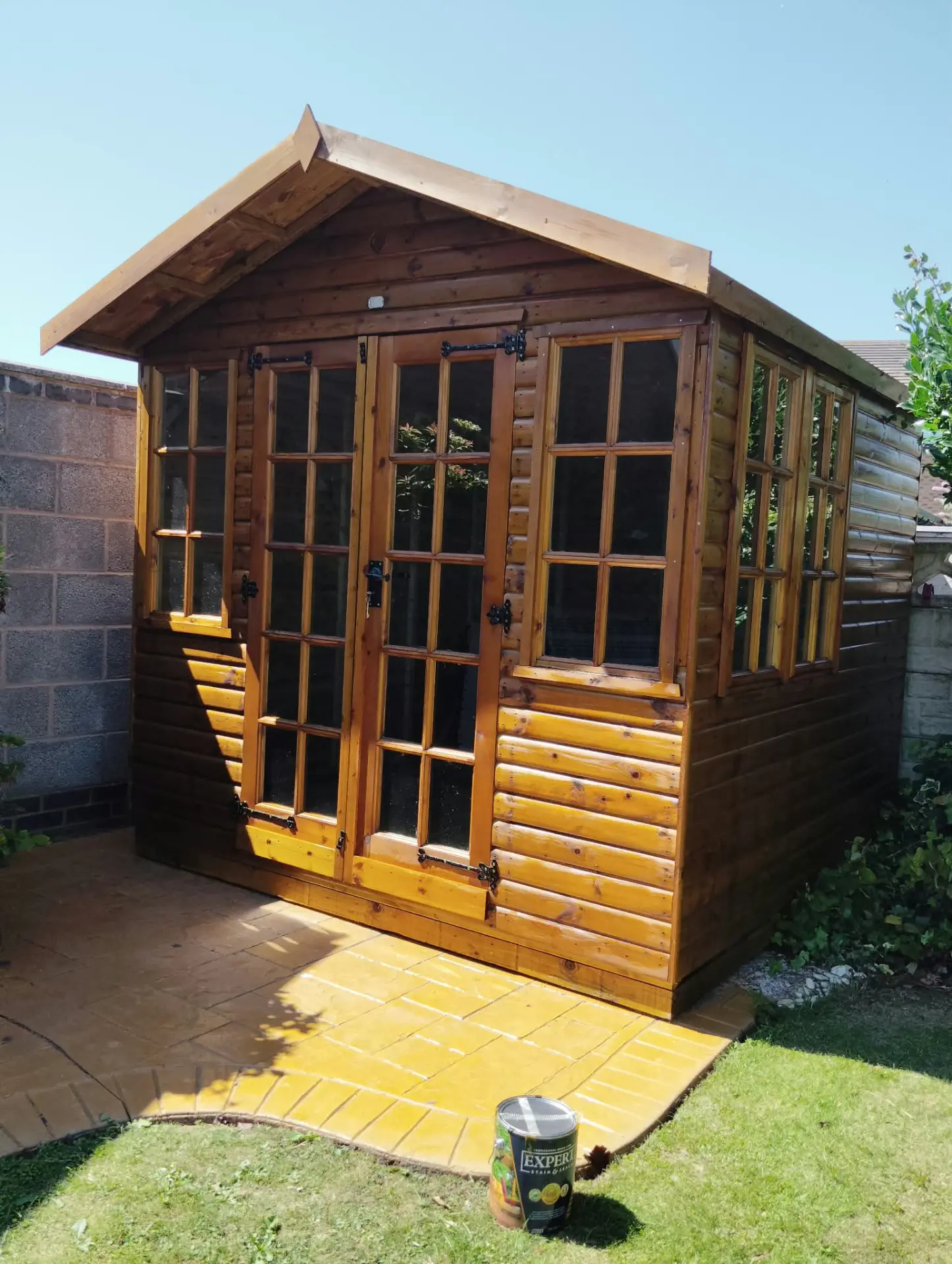 Timber summerhouse fully restored, cleaned and re-stained with a rich protective finish