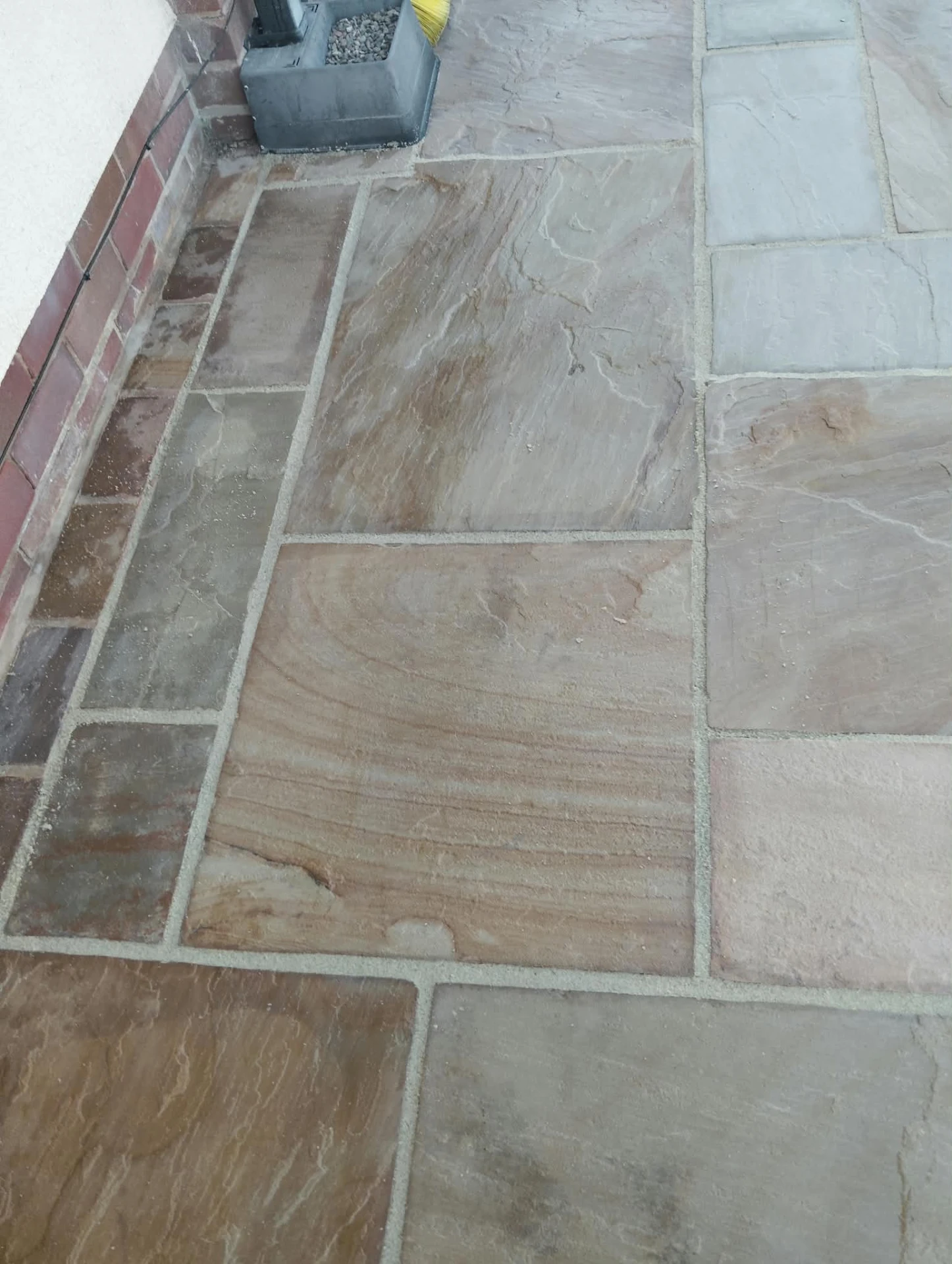 Close view of cleaned sandstone flags with fresh jointing sand